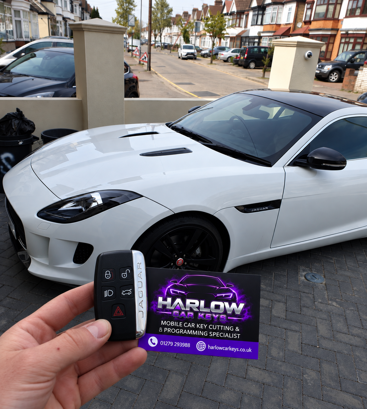 New key supplied for a 2017 Jaguar F-TYPE in Epping after all keys were lost, held in front of the car with a Harlow Car Keys business card