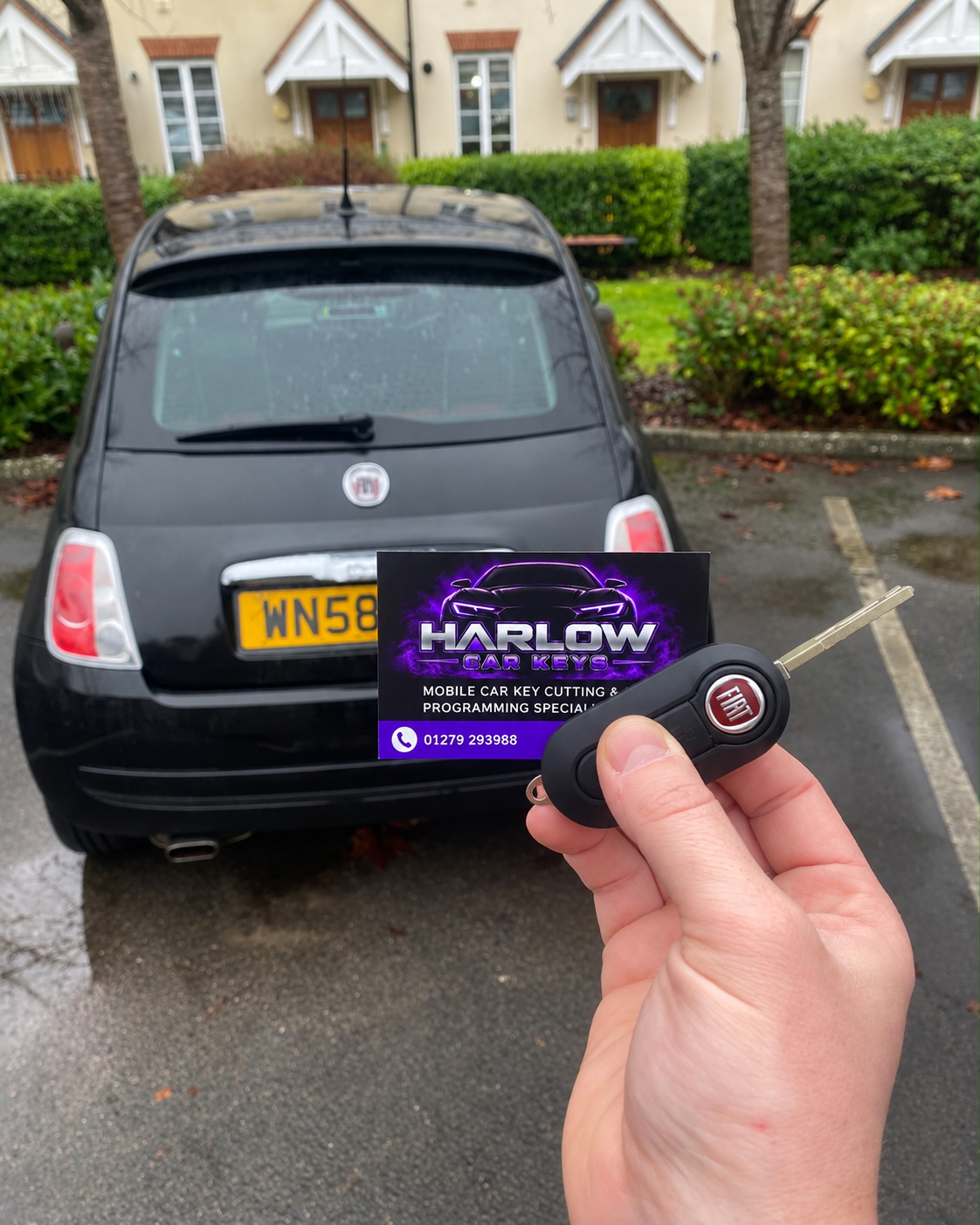 New key made for a 2008 Fiat 500 in Bishop's Stortford after all keys were lost, held in front of the car with a Harlow Car Keys business card