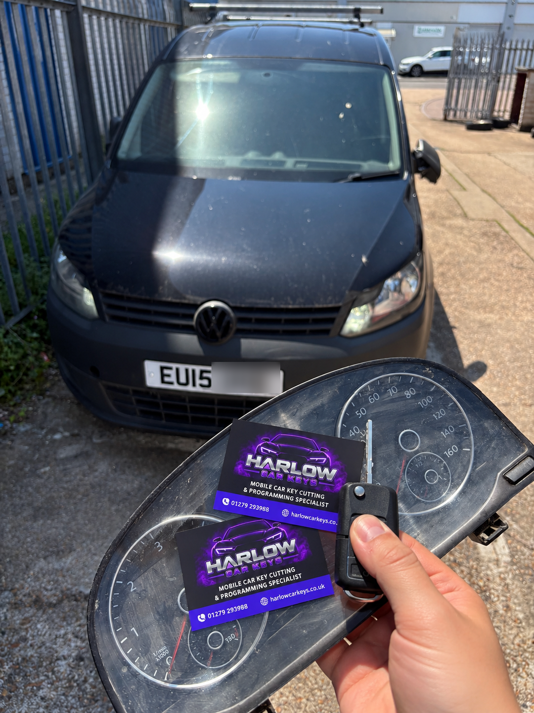 Replacement key for a 2015 Volkswagen Caddy in Epping after all keys were lost, shown with the removed instrument cluster and Harlow Car Keys business cards